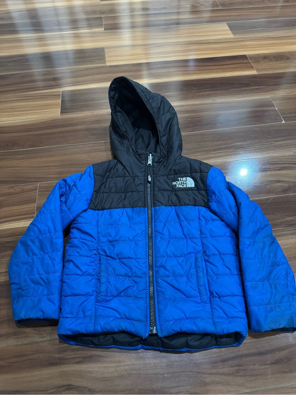The North Face Blue and Black Hooded Puffer Coat. Reversible jacket. 5 y/o